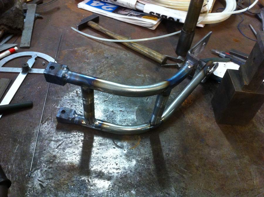 Frame for the forward/mid controls and oil cooler