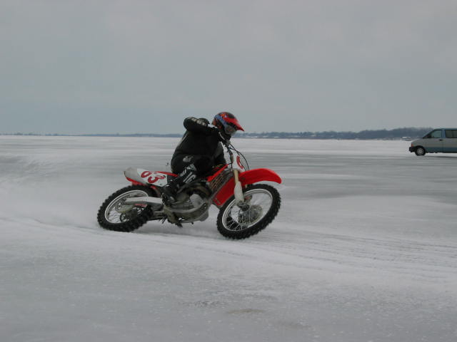 Local Bueller Jason enjoying a bit of  riding on Lake Erie. Erie PA, home of some of the above machinery, is just on the horizon behind him